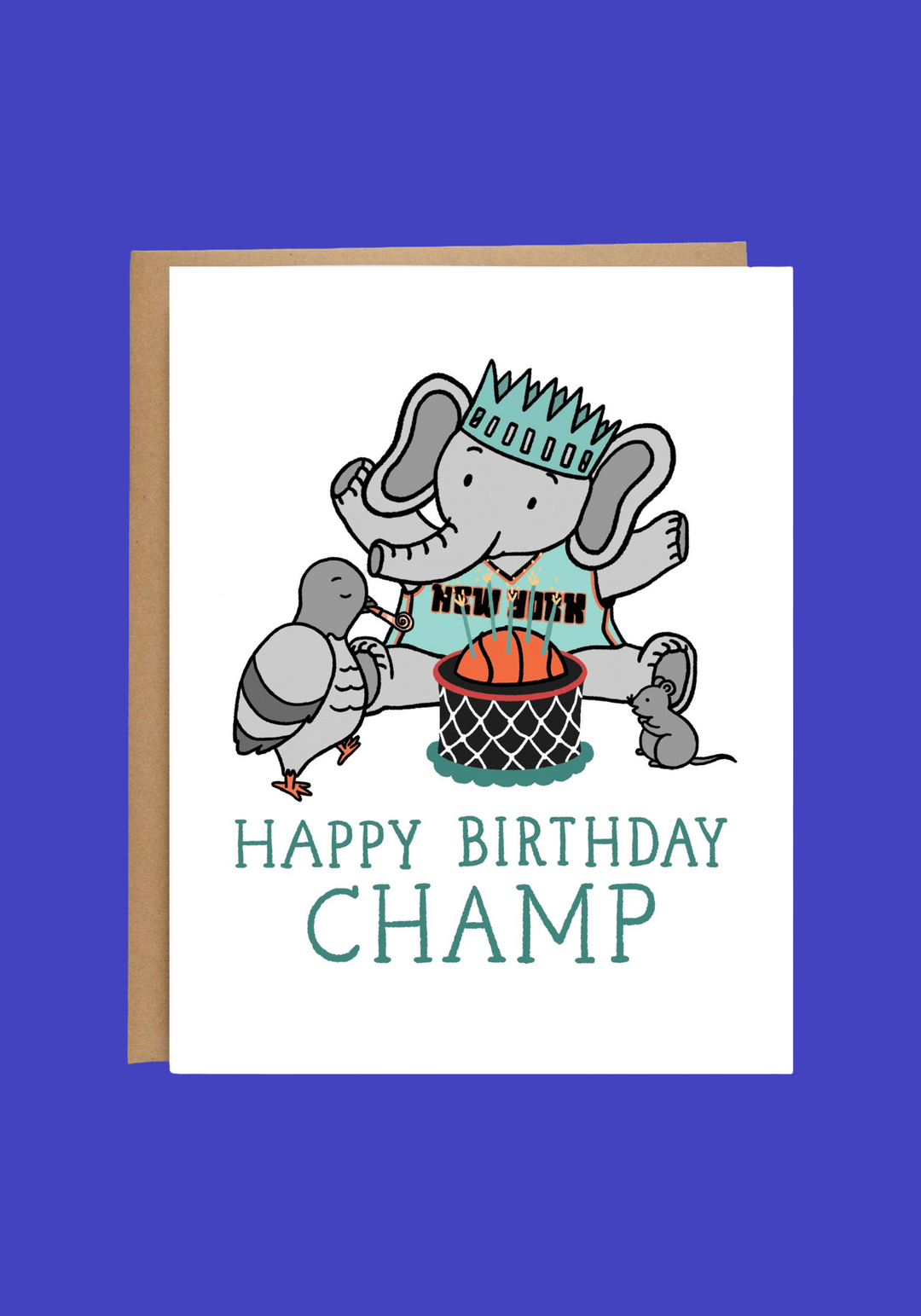 A white greeting card with a brown kraft envelope behind it, featuring a cartoon elephant based on Ellie, the NY Liberty's mascot wearing a New York jersey and crown, with a basketball and the text 'HAPPY BIRTHDAY CHAMP'.