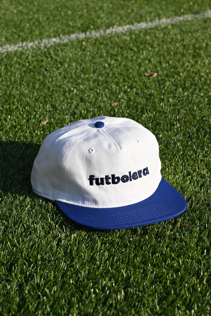 White cap with blue brim and &