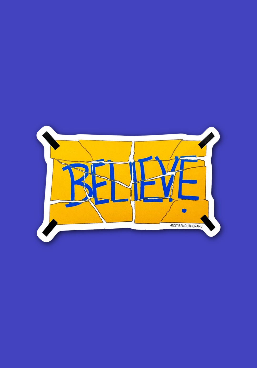 A die-cut vinyl sticker with a yellow cracked-tile design and the word &